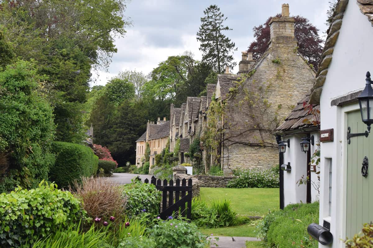 Honey-coloured stone cottages lining the street in Castle Combe